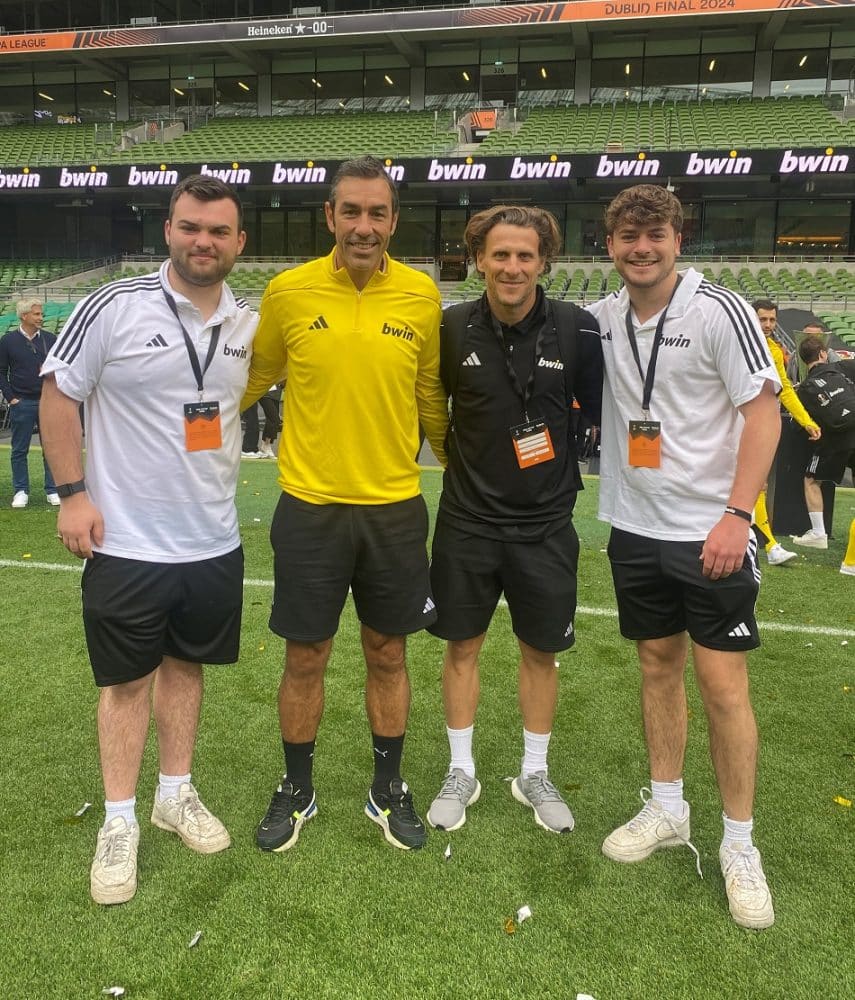 OVs Josh Moorhouse and Ali Robb with footballers for his football award